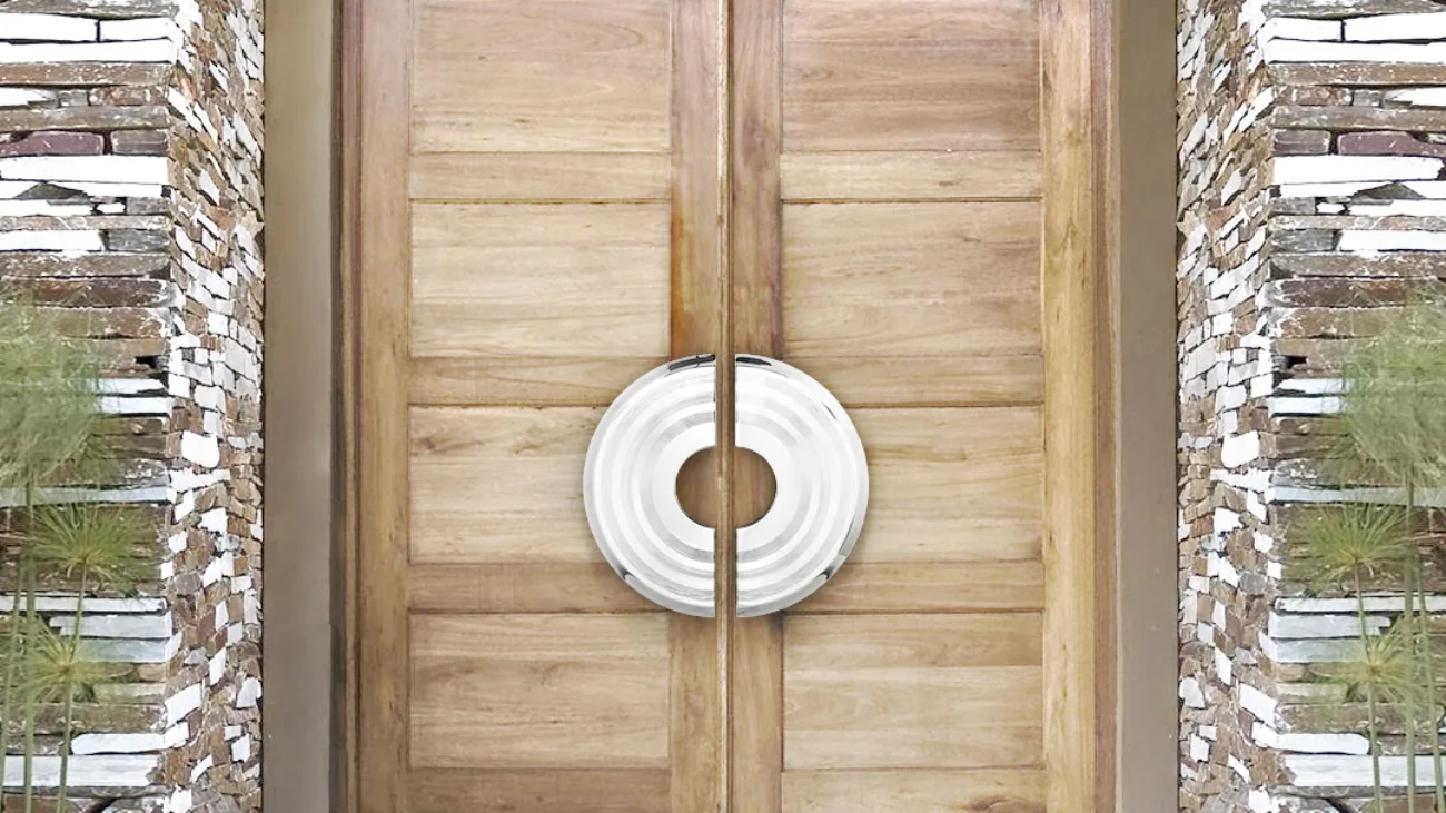 Oversized circular door pulls on a pair of wood entry doors