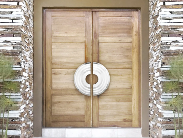 Oversized circular door pulls on a pair of wood entry doors